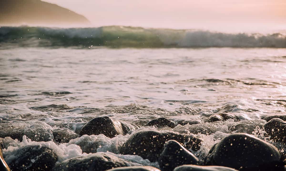 rocky-shore-waves-1200x720px Image of a rocky shoreline with waves lapping