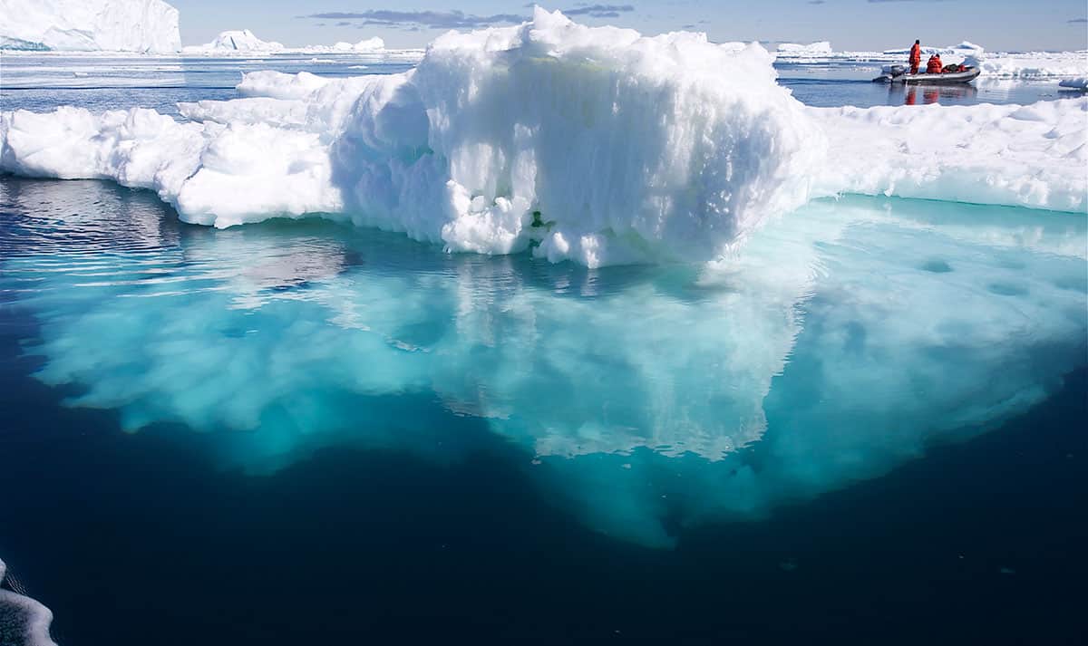 Antarctica-iceberg-1200-x-720px Mother and child sitting above Nelson's Cable Bay